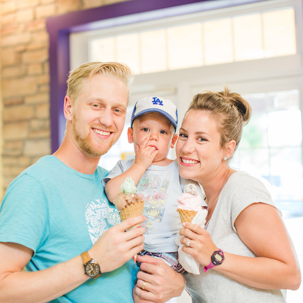 An Iowa family enjoying ice cream at Over The Top's parlor.